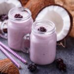 coconut oil in smoothies with half a coconut