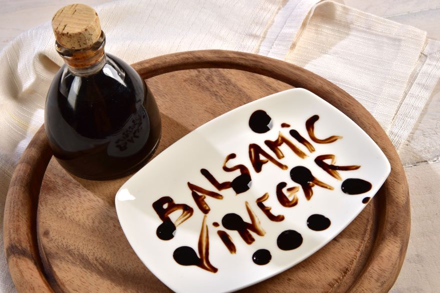 Balsamic vinegar calories in a bottle on a tray with sign