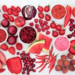 Red superfoods on a grey background