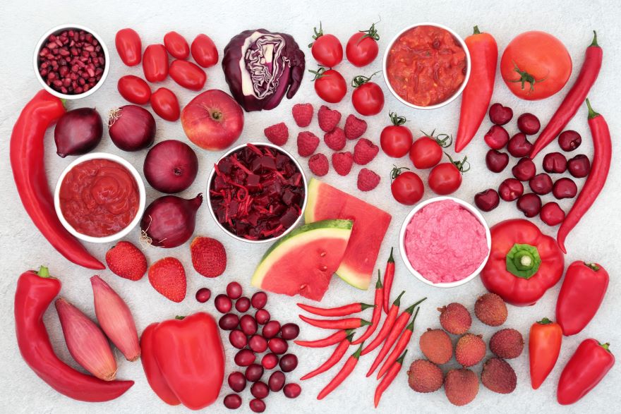 Red superfoods on a grey background