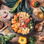 Dairy-free casserole with lots of vegetables in dish and around it