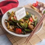 Gluten-free stir fry in a bowl with chopsticks