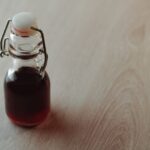 Is malt vinegar gluten-free? in a bottle on wooden background