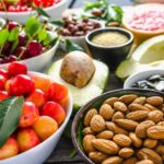Whole-food plant-based snacks with bowls of fruit and nuts