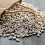 What are navy beans, with beans spilling out a bag