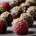 Chocolate covered raspberries, some coated and some plain