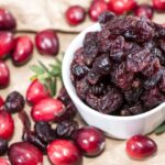 How to dry cranberries in a bowl with fresh cranberries around it
