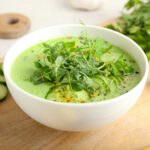 Chilled cucumber gazpacho in a white bowl