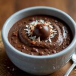 Oat milk chocolate pudding with sea salt in a white bowl
