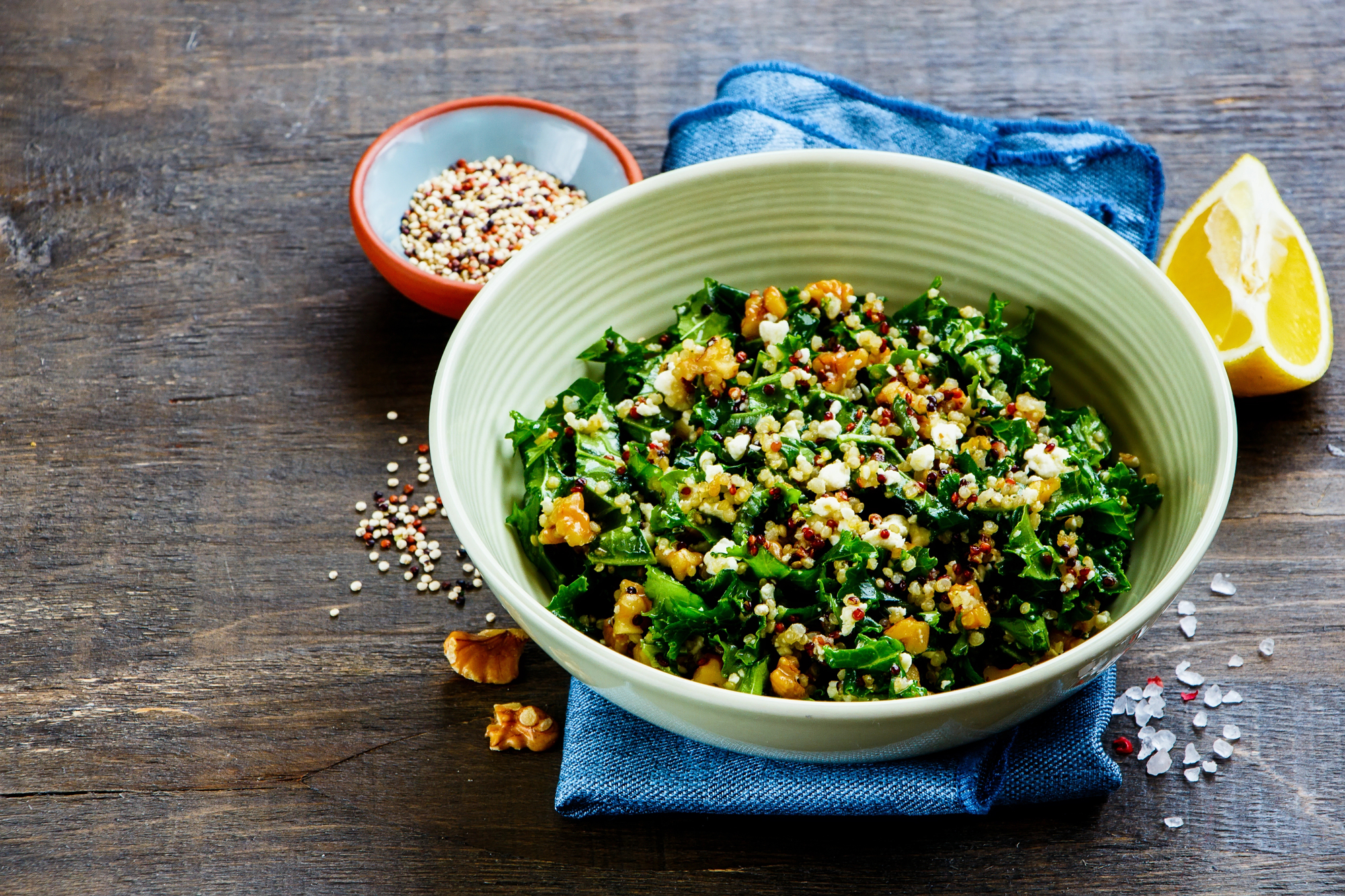 One-pot quinoa and frozen spinach protein bowl with lemon tahini drizzle in a white bowl