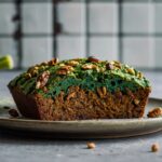 Superfood zucchini bread with spirulina and walnuts on a plate