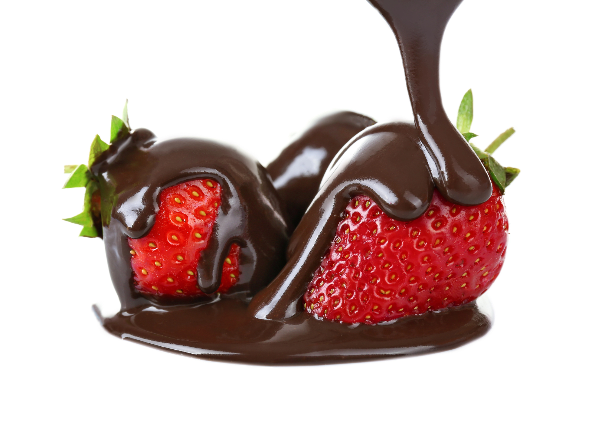 Frozen chocolate-covered strawberries with chocolate pouring on top