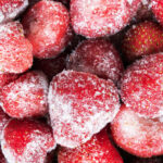 Frozen strawberries covered in ice