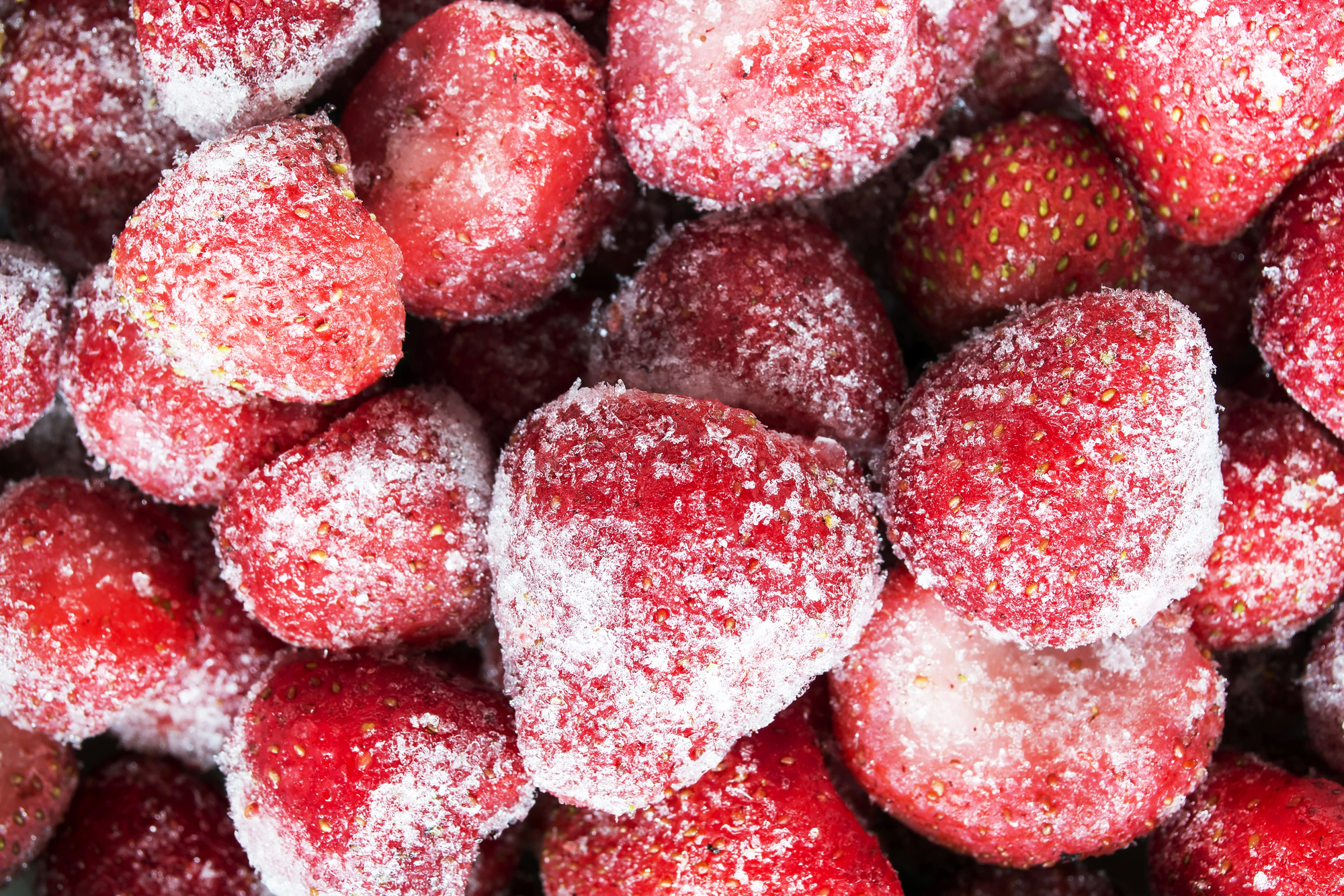 Frozen strawberries covered in ice